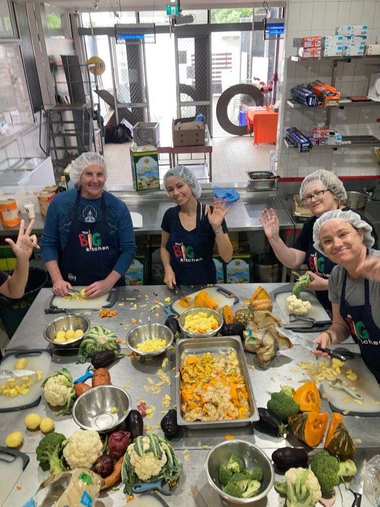 DataColada team members prepping the vegetables for the curry stew to be packaged up for homeless shelters.